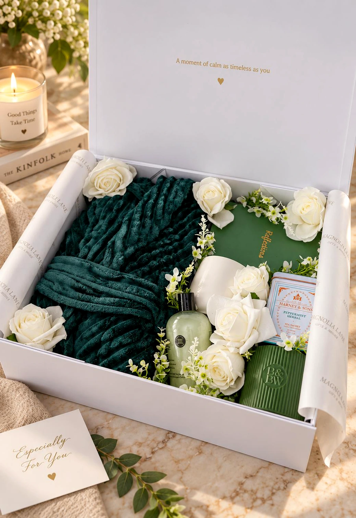 The Grace experience with an emerald robe, white roses, tea, and reflective details